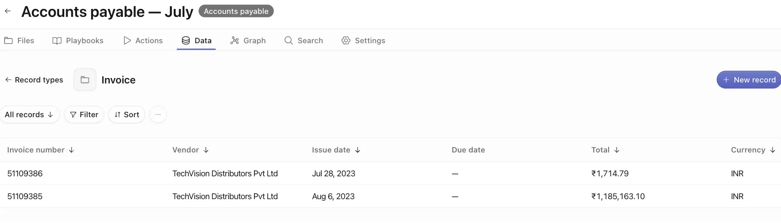 The space Data tab showing the Invoice record type's table with two approved invoice records as rows
